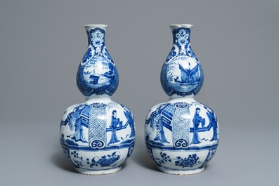 A pair of Dutch Delft blue and white double gourd chinoiserie vases, 18th C.